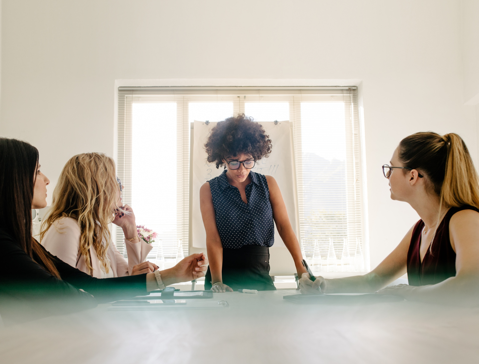 Group of Women Having a Meeting in Boardroom